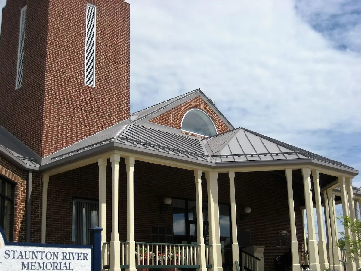 Skilled roofing craftsmen working on a residential roof in Gray